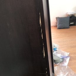 Splinters of wood missing from my bookshelf from movers sliding it on top of my mattress, which now has tears and splinters imbedded in it. Splinters of wood missing from my bookshelf from movers sliding it on top of my mattress, which now has tears and splinters imbedded in it.