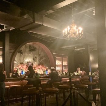 Vinyl - a dimly lit bar with a chandelier - Cocktail Bars Near Me - Philadelphia, Pennsylvania Vinyl - a dimly lit bar with a chandelier - Cocktail Bars Near Me - Philadelphia, Pennsylvania