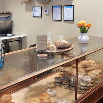 Meshuggah Bagels - Vintage wooden dough bowls and bakery showcase - Seafood Near Me - Kansas City, Missouri Meshuggah Bagels - Vintage wooden dough bowls and bakery showcase - Seafood Near Me - Kansas City, Missouri
