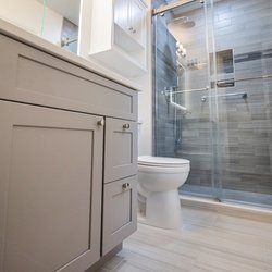Aladdin Carpet & Floors - Master bathroom remodeling with Gray vanity and neutral color pallet. Design and installed by Aladdin Carpet and Floors.
