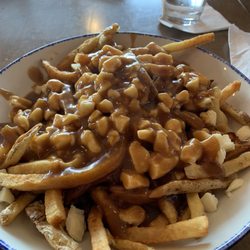 Swiss Chalet Rotisserie & Grill - Meal size poutine. Can easily feed 2-3 people.
