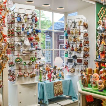 Christmas Shop - Inside the store looking out the front window. With Russian nesting dolls on the right with Russian Santa's - Shopping Near Me - Williamsburg, Virginia