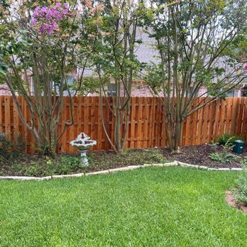 Aqua Blu Services - a garden with a fence and a birdbath - General Contractors Near Me - San Antonio, Texas