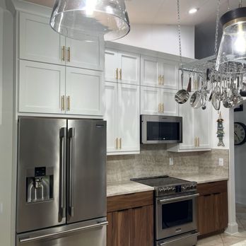 Grandview Kitchens - Luxury Walnut Base cabinets with Frost White Shaker stacked upper cabinets - Cabinetry Near Me - Royal Palm Beach, Florida