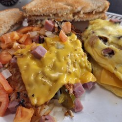 Ham and cheese omelette with hash browns all the way minus mushrooms