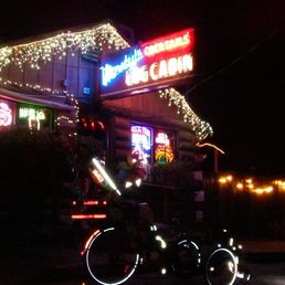 The #Hillbillymobile recumbent trike lit up and sobered in front of Monty's Cocktails Log Cabin, Felton, CA, USA The #Hillbillymobile recumbent trike lit up and sobered in front of Monty's Cocktails Log Cabin, Felton, CA, USA