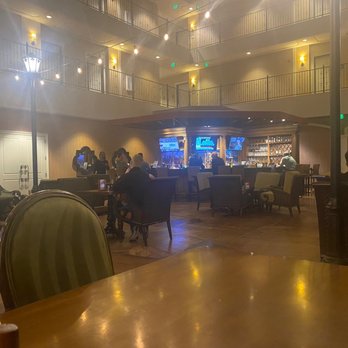 Woolley's Grill & Lounge - Inside looking at the bar - New American Near Me - Aurora, Colorado Woolley's Grill & Lounge - Inside looking at the bar - New American Near Me - Aurora, Colorado