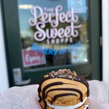 The Perfect Sweet Shoppe - a hand holding a dessert - Bakeries Near Me - Warren, Rhode Island