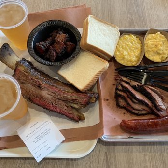 Killen's Barbecue - 1/2 lb burnt ends and beef rib (left tray), creamed corn and mac & cheese, brisket, and sausage (right tray) - Barbeque Near Me - Pearland, Texas