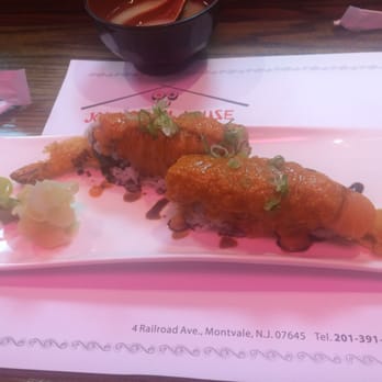 Johnny Roll House - Fire Dragon Roll - with ginger sauce on top of salmon and shrimp tempura. It sounds spicy but it's not. - Japanese Near Me - Montvale, New Jersey Johnny Roll House - Fire Dragon Roll - with ginger sauce on top of salmon and shrimp tempura. It sounds spicy but it's not. - Japanese Near Me - Montvale, New Jersey