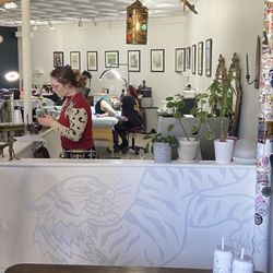 The Calling Bell - Service counter, tattoos stations and gallery wall.