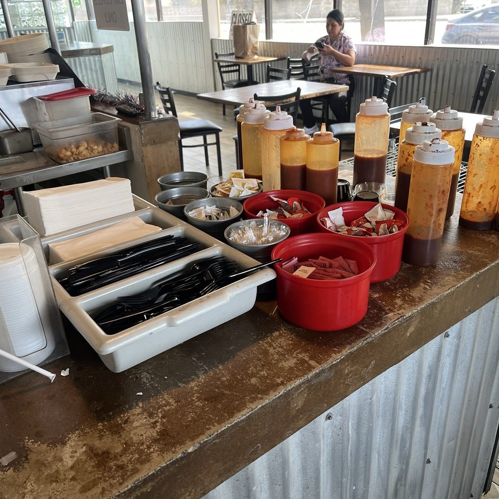 Rosie's BBQ Kitchen - Self-serve station for utensils, condiments, and barbecue sauce. - Barbeque Near Me - Chatsworth, California Rosie's BBQ Kitchen - Self-serve station for utensils, condiments, and barbecue sauce. - Barbeque Near Me - Chatsworth, California