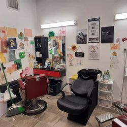 Oliver's Barber Shop - His daughter draws pics for him and they are other wall. Nice personal touch