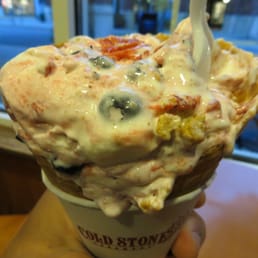 Signature "cheesecake fantasy" ice cream in a cone in the "gotta have it" size