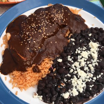 Frida's Mexican Grill - Tami's mole burrito with black beans and rice. - Mexican Near Me - Napa, California Frida's Mexican Grill - Tami's mole burrito with black beans and rice. - Mexican Near Me - Napa, California
