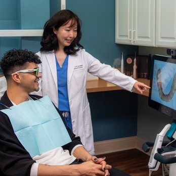 Elite Dental - Chicago dentist Dr. Grace E. Lee explaining Invisalign procedure using iTero Element 5D Plus intraoral scanner at Elite Dental - General Dentistry Near Me - Chicago, Illinois