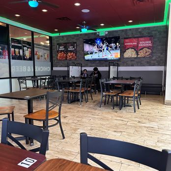 bb.q Chicken - Dining area, tv, white boards - Korean Near Me - Cypress, California