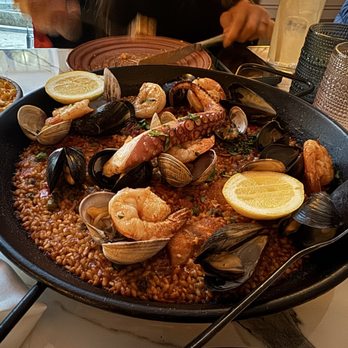 Reyna - Not the best paella I've had. I give it  4 out of 10, that being generous. Rice undercooked. Flavor meh. Presentation isn't everything. - Mediterranean Near Me - New York, New York