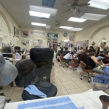 Splendid Nails - Inside - A nail salon interior with clients seated in pedicure chairs and receiving nail services, with salon equipment and decor visible. - Nail Salons Near Me - Glendale, Arizona