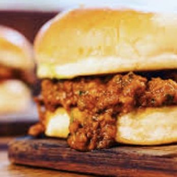 Karachi Xpress - a sloppy beef sandwich on a cutting board - Pakistani Near Me - Toronto, Ontario Karachi Xpress - a sloppy beef sandwich on a cutting board - Pakistani Near Me - Toronto, Ontario
