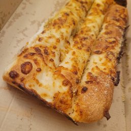 half eaten cheesey bread