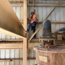 Rushmore Plumbing - MHSA certified - fixing a leak on a 90 50ft in the air