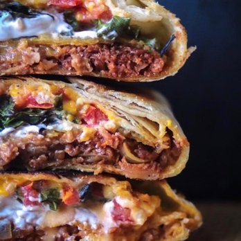 Man vs Fries - a close up of a cheesy beef quesadilla - Food Delivery Services Near Me - Houston, Texas