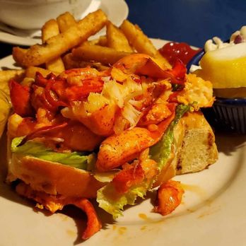 Boston Sail Loft - Hot lobster roll with a side of butter. - Bars Near Me - Boston, Massachusetts