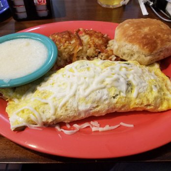 Carolina’s Diner - The Philly Cheeseteak omelet with grits, hash browns, and a biscuit. Try the biscuit with apple cinnamon jelly. You won't be disappointed. - Diners Near Me - High Point, North Carolina