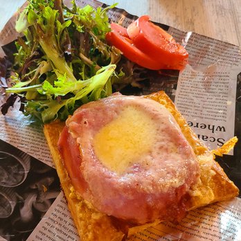 Jerome's Cafe & Bakery - Quiche, with ham and cheese on top. Served with greens. Delicious! - Cafes Near Me - Clearwater, Florida