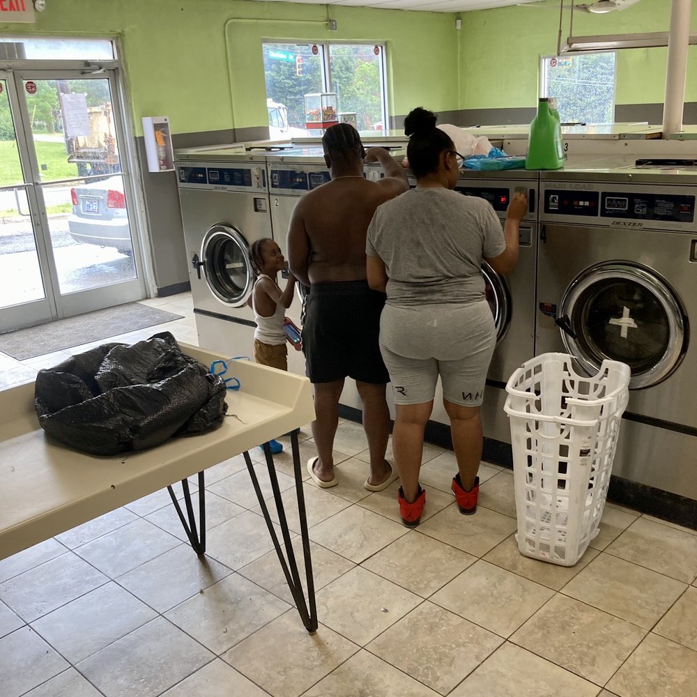 Super Coin Laundry - Young, black couple undresses (a bit) and unloads their two-bins full of laundry before leaving it to wash. - Laundromat Near Me - Winston-Salem, North Carolina Super Coin Laundry - Young, black couple undresses (a bit) and unloads their two-bins full of laundry before leaving it to wash. - Laundromat Near Me - Winston-Salem, North Carolina