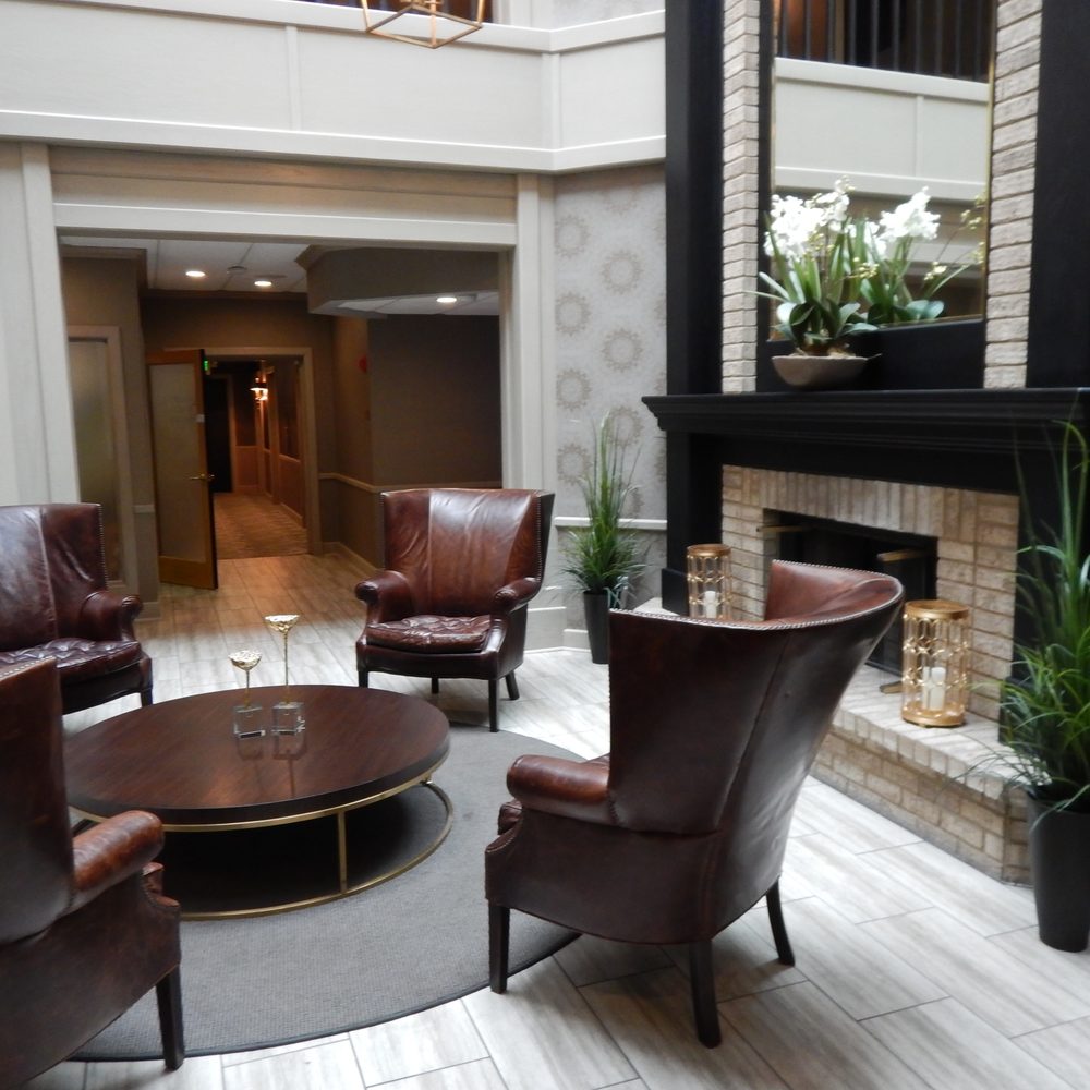 This fireplace in in the lobby. Behind the fireplace is the bar. This fireplace in in the lobby. Behind the fireplace is the bar.