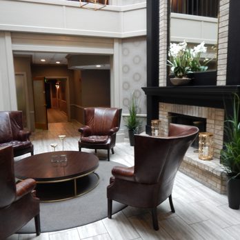 The Geneva Inn - This fireplace in in the lobby. Behind the fireplace is the bar. - Hotels Near Me - Lake Geneva, Wisconsin The Geneva Inn - This fireplace in in the lobby. Behind the fireplace is the bar. - Hotels Near Me - Lake Geneva, Wisconsin