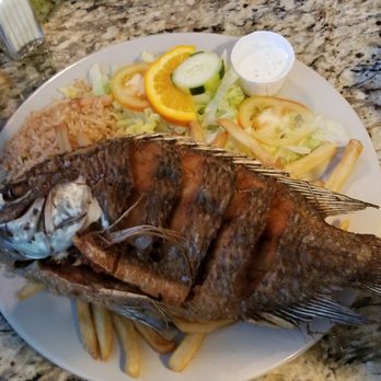 Ostioneria Michoacan - a whole fish on a plate - Seafood Near Me - Houston, Texas Ostioneria Michoacan - a whole fish on a plate - Seafood Near Me - Houston, Texas