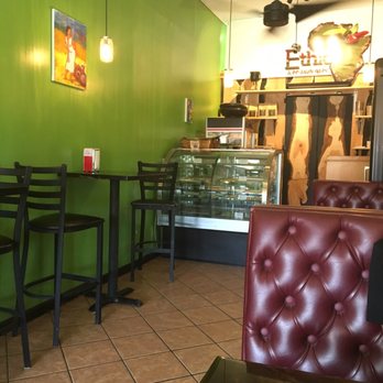 Authentic EthioAfrican - Three small tables along wall, three booths & three little tables outside - Ethiopian Near Me - Phoenix, Arizona Authentic EthioAfrican - Three small tables along wall, three booths & three little tables outside - Ethiopian Near Me - Phoenix, Arizona