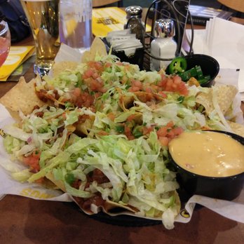 Buffalo Wild Wings - Ultimate Nachos. I requested the cheese sauce on the side. - Sports Bars Near Me - Gaithersburg, Maryland Buffalo Wild Wings - Ultimate Nachos. I requested the cheese sauce on the side. - Sports Bars Near Me - Gaithersburg, Maryland