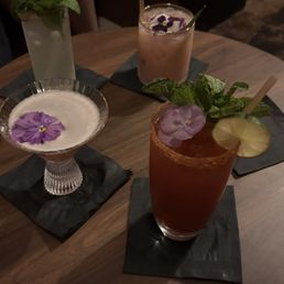 Tall glass on the top left: Chili Margarita Bottom left: Cosmopolitan Bottom right: Michelada Top: Mandora Negroni Tall glass on the top left: Chili Margarita Bottom left: Cosmopolitan Bottom right: Michelada Top: Mandora Negroni