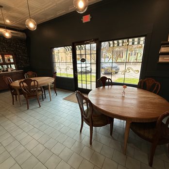 Flake Bakery And Larder - Indoor seating includes 2 large 4 tops and a few 2 tops. - Bakeries Near Me - Taylor, Texas