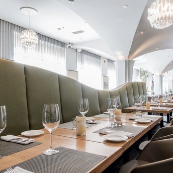 La Tomate Blanche - a long table with wine glasses and place settings - Italian Near Me - Brossard, Quebec La Tomate Blanche - a long table with wine glasses and place settings - Italian Near Me - Brossard, Quebec