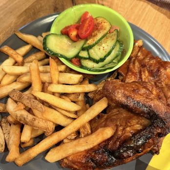 Nando's Peri-Peri - Quarter white meat with fries - Chicken Shop Near Me - Addison, Texas Nando's Peri-Peri - Quarter white meat with fries - Chicken Shop Near Me - Addison, Texas