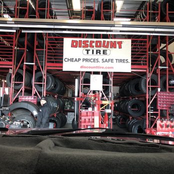 Discount Tire - Guy fixing tire. - Tires Near Me - Fayetteville, Arkansas Discount Tire - Guy fixing tire. - Tires Near Me - Fayetteville, Arkansas