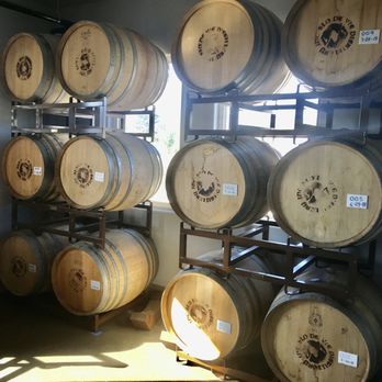Slo De Vie - a room full of wine barrels - Distilleries Near Me - Grover Beach, California
