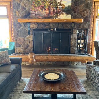 Overlander Mountain Lodge - Another view of the real fireplace. - Hotels Near Me - Hinton, Alberta
