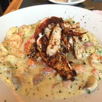 Cajun Queen - cajun pasta - cheese tortellini w/red pepper, andouille sausage, artichokes in spicy cream sauce & topped w/ blackened chicken - Cajun/Creole Near Me - Charlotte, North Carolina