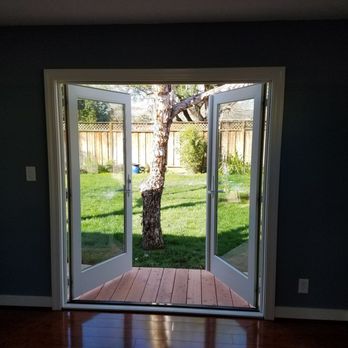 Abrew Construction - a view of a backyard through a sliding glass door - General Contractors Near Me - Pleasanton, California