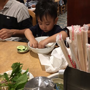 Pho Pasteur - Brother Tyrone digging in on his dinner, he was not impressed with this place. - Vietnamese Near Me - Boston, Massachusetts