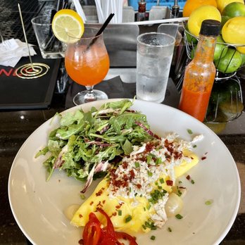 Pinky’s - Crab French omelette, lemon dill arugula salad, blood orange cocktail, homemade hot sauce - Mediterranean Near Me - Richmond, Virginia Pinky’s - Crab French omelette, lemon dill arugula salad, blood orange cocktail, homemade hot sauce - Mediterranean Near Me - Richmond, Virginia