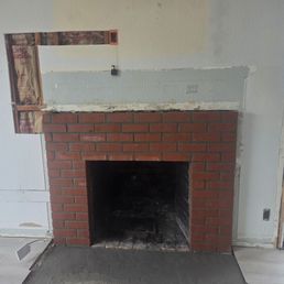 Refacing, lintel installation bringing chimney system up to code.