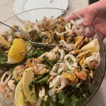 Volare - a person holding a fork in a bowl of food - Italian Near Me - Tannersville, Pennsylvania Volare - a person holding a fork in a bowl of food - Italian Near Me - Tannersville, Pennsylvania