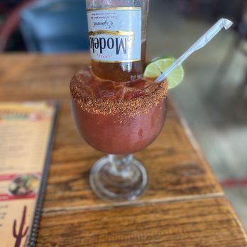 Cinco De Mayo - a drink in a glass on a table - Mexican Near Me - Long Beach, California Cinco De Mayo - a drink in a glass on a table - Mexican Near Me - Long Beach, California